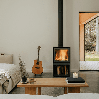 Interior of a home with a fireplace, a couch, and a coffee table made from Ponderosa Pine